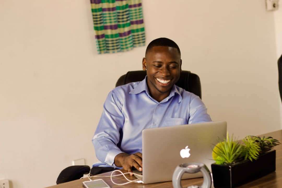 Francis Kofigah working at his desk in Accra, Ghana